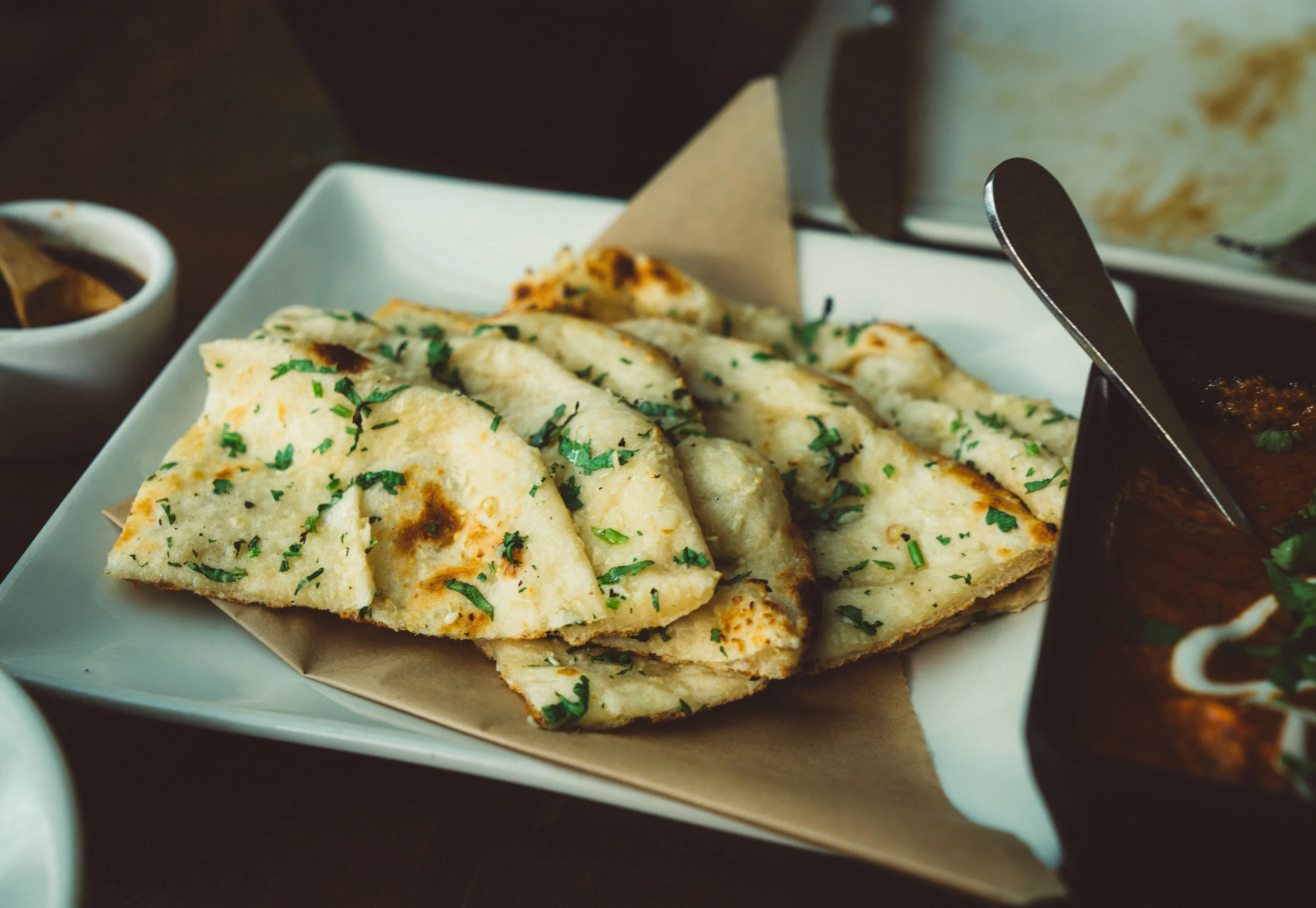 Our personal favourite dish, the killer cilantro and garlic naan.