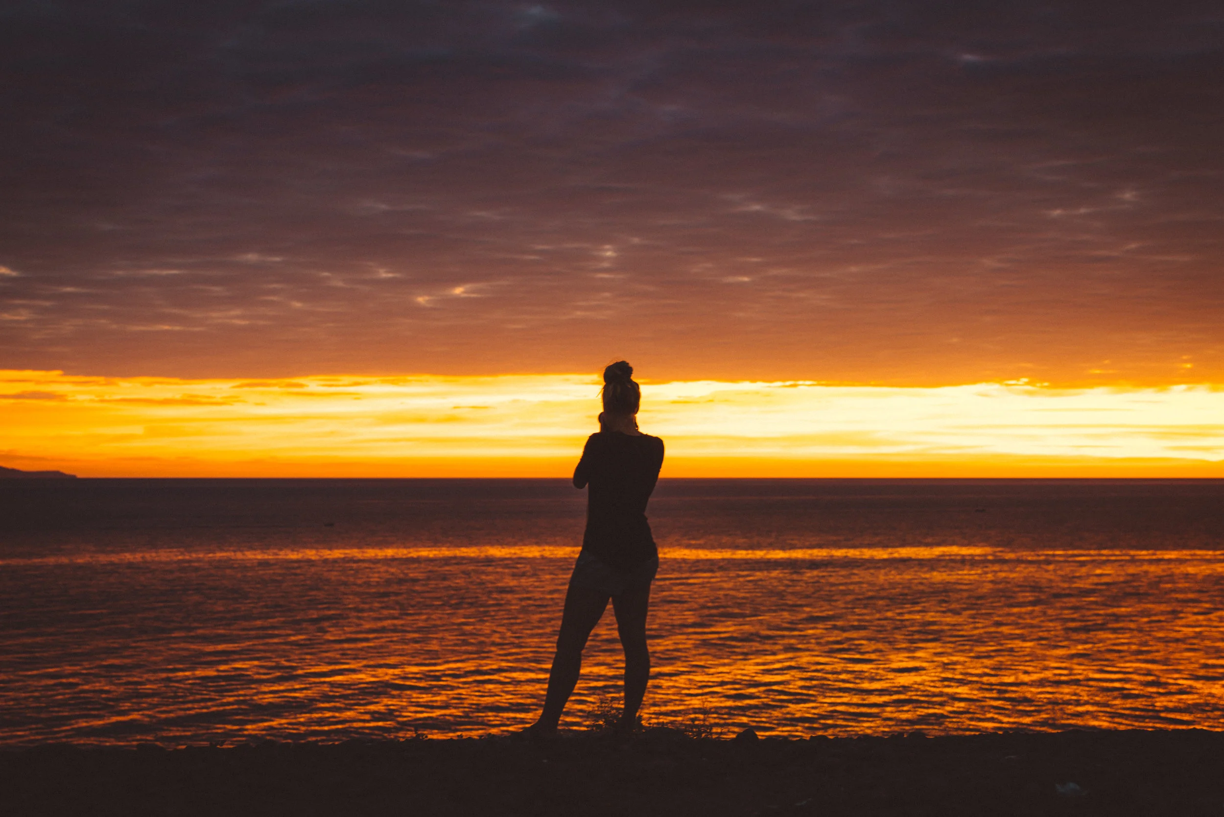 Danielle capturing the brilliant sunset from our campsite just outside Santa Rosalía.