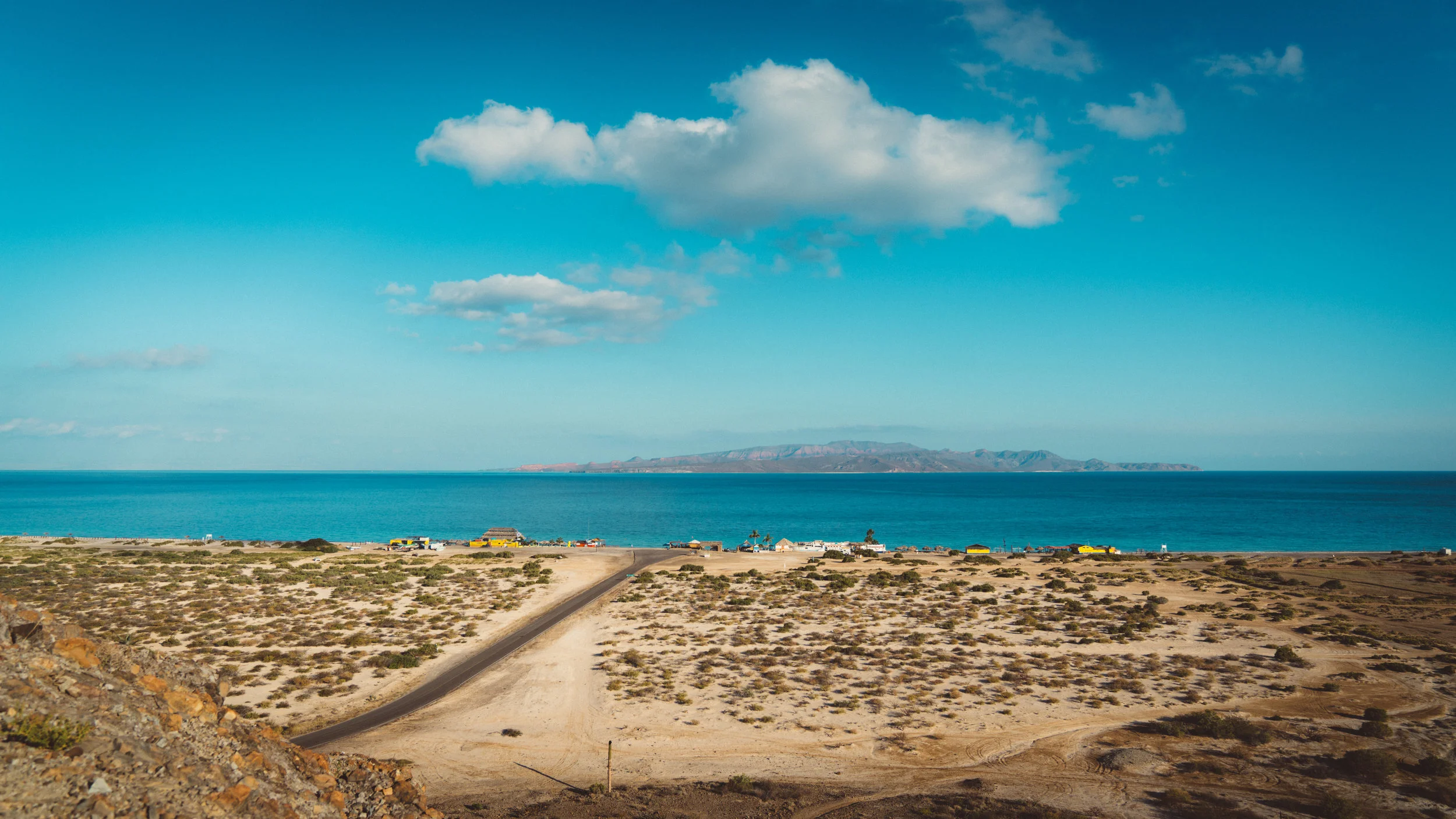 The beach we camped at as seen from the hill we climbed. The small bars visible.