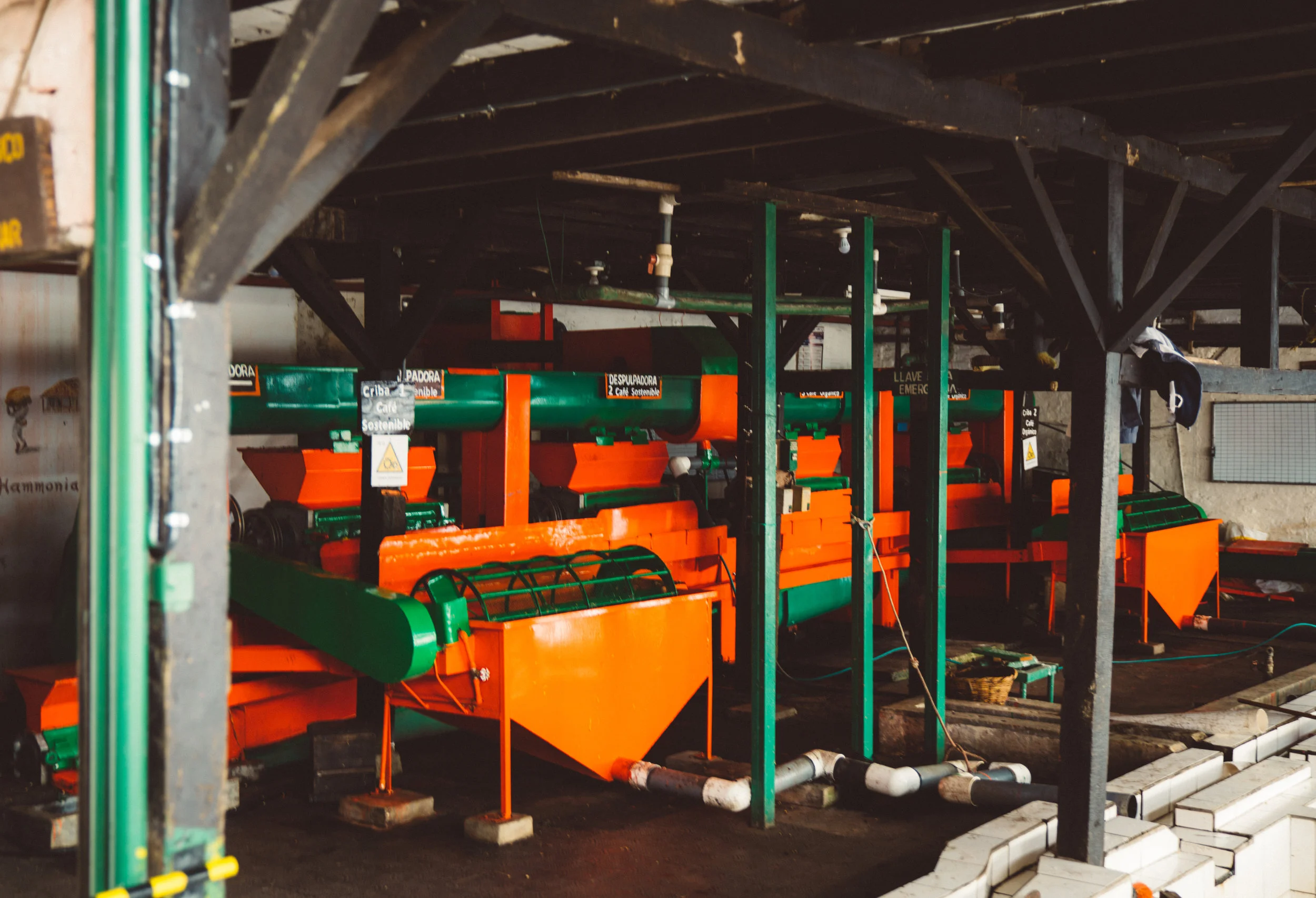 From the sorting tank pictured above, the berries flow down a tube into this expensive and shiny de-shelling machine.