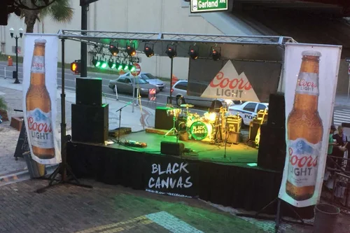 Step Up Productions staging set up for a band with areas for sponsors.