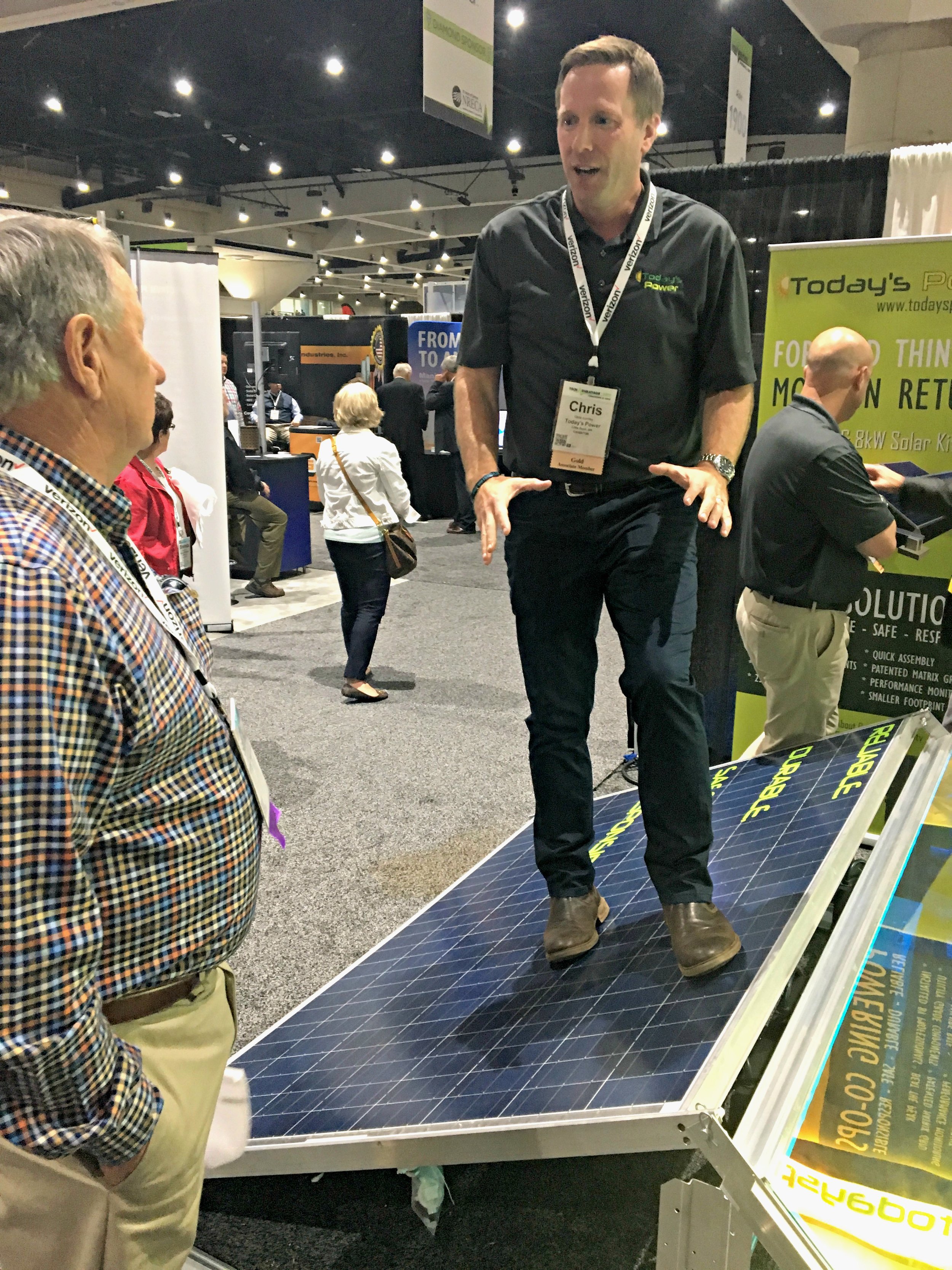 Director of Business Development, Chris Burnley demonstrates module durability to Co-op leaders on the TechAdvantage floor. 