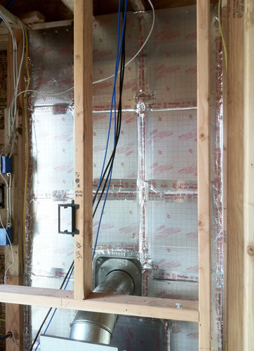 Step 3: Seal the face of the wall with foil-faced rigid board. Tape the joints closed with foil tape for optimum resistance to heat radiation through the wall.