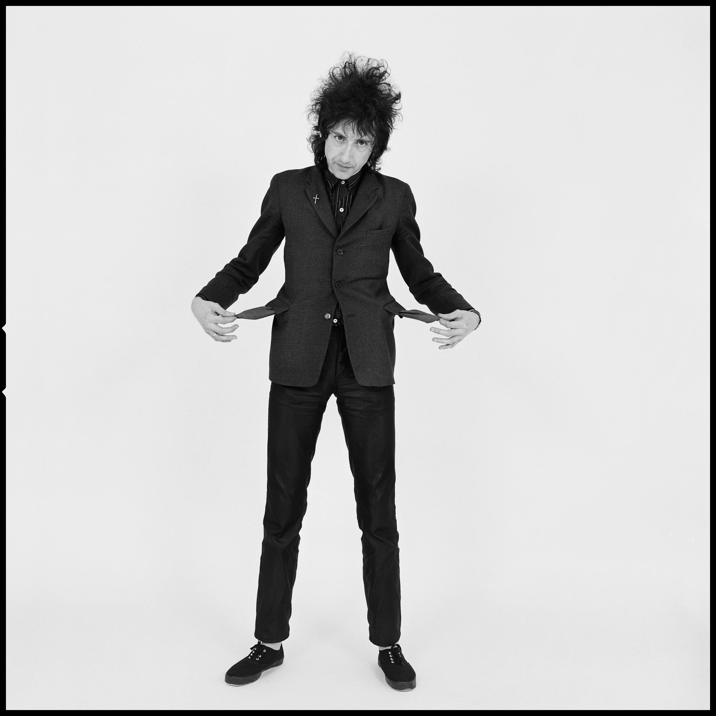 John Cooper Clarke - The Kew Gardens Studio Of course if I had to nominate my favourite Mancunian from our generation, it would be John Cooper Clarke, we had built a Studio in the Garage at the house I shared in Kew with Phil Lynott, this was the beginning of the end of an era for me, once I had started Studio Photography I never left it, John was the inaugural Shoot, what can I tell you about it? Well he was just non stop funny, that wonderful deep Mancunian accent, the motor mouth delivery, total fun, he was awesome then and he is awesome now. Not only that but he looks just the same, birds nest hair and those piercing eyes, but the voice! How can you ever forget the voice! In fact, if i'm ever in need of cheering up I simply play "I Married a Monster from Outer Space" and my blues fly out of the (Studio) window...