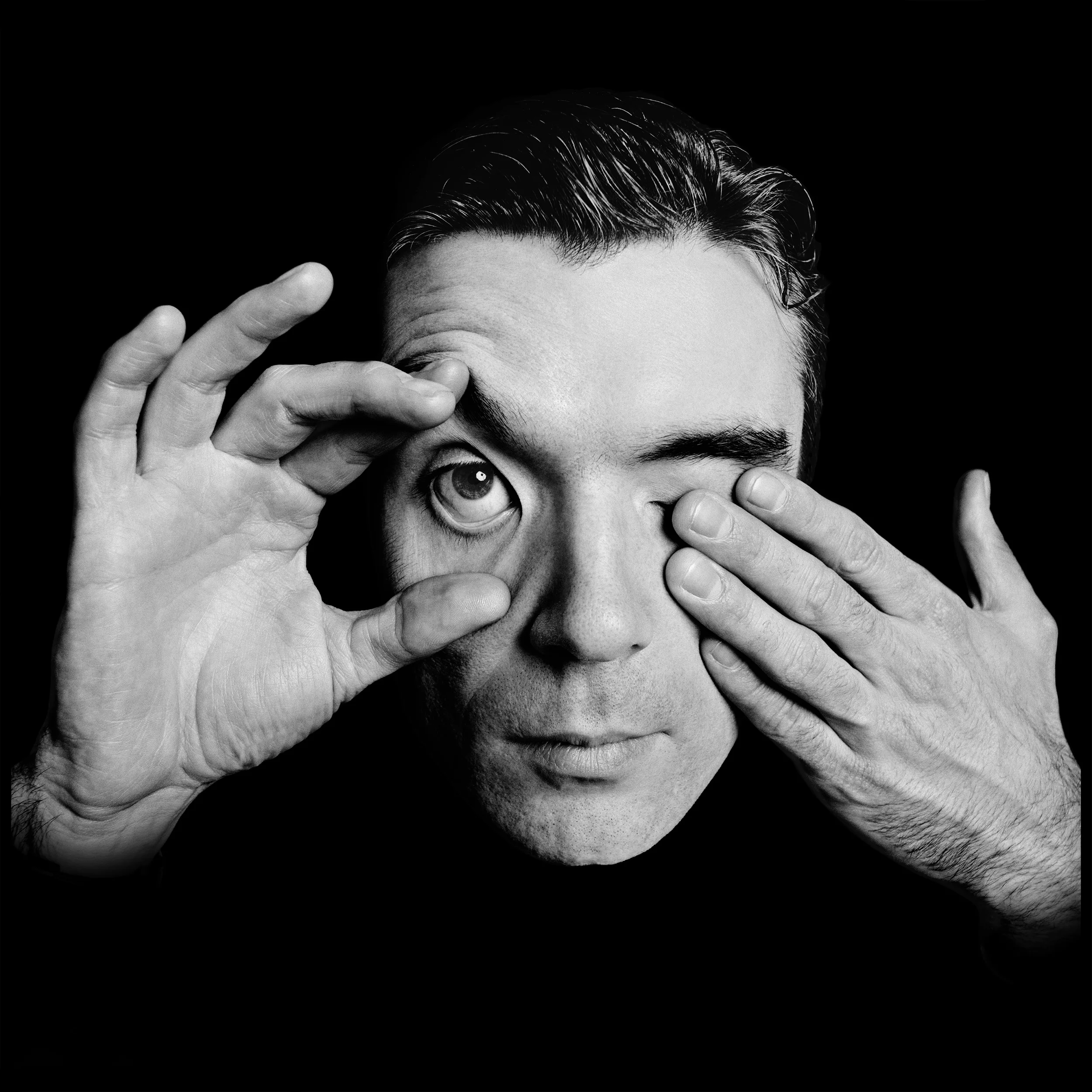 David Byrne - London 1981 There is something about David Byrne that makes you take good pictures, almost like you don't want to bother him with something that's not interesting, I worked with him a number of times, but the 30 minute session we did for an early issue of the Face was the most productive. It was shot in the basement of the Warner Bros building in Soho. There was a gym down there and quite often I built a little studio in the space, I did the Pretenders, Laurie Anderson, even Aha in that basement. We told David the ideas and he cooperated fully, we decided to shoot on black to emphasize his face, after all it's one of his most interesting features, we shot him distorting it, pulling the skin this way and that, ending up with the classic frame of him opening his eye, quite literally in fact. We also experimented with double exposures, combining profiles with straight on views, now you would do it in photoshop but back then it was all in camera. And also one set of pictures where I used three consecutive frames to shoot his body, to show his height, and to make something other than a simple 3/4 length photo shot the usual way. It's amazing what you can do in 30 minutes with the right person, David Bowie is someone else that inspires you to try anything, and to trust your judgement and forget any normal poses. I always remember Brian Eno's observation, That it will be so great when Byrne and Bowie are really old, they can sit together on an island and still look cool. Of that I have no doubt.