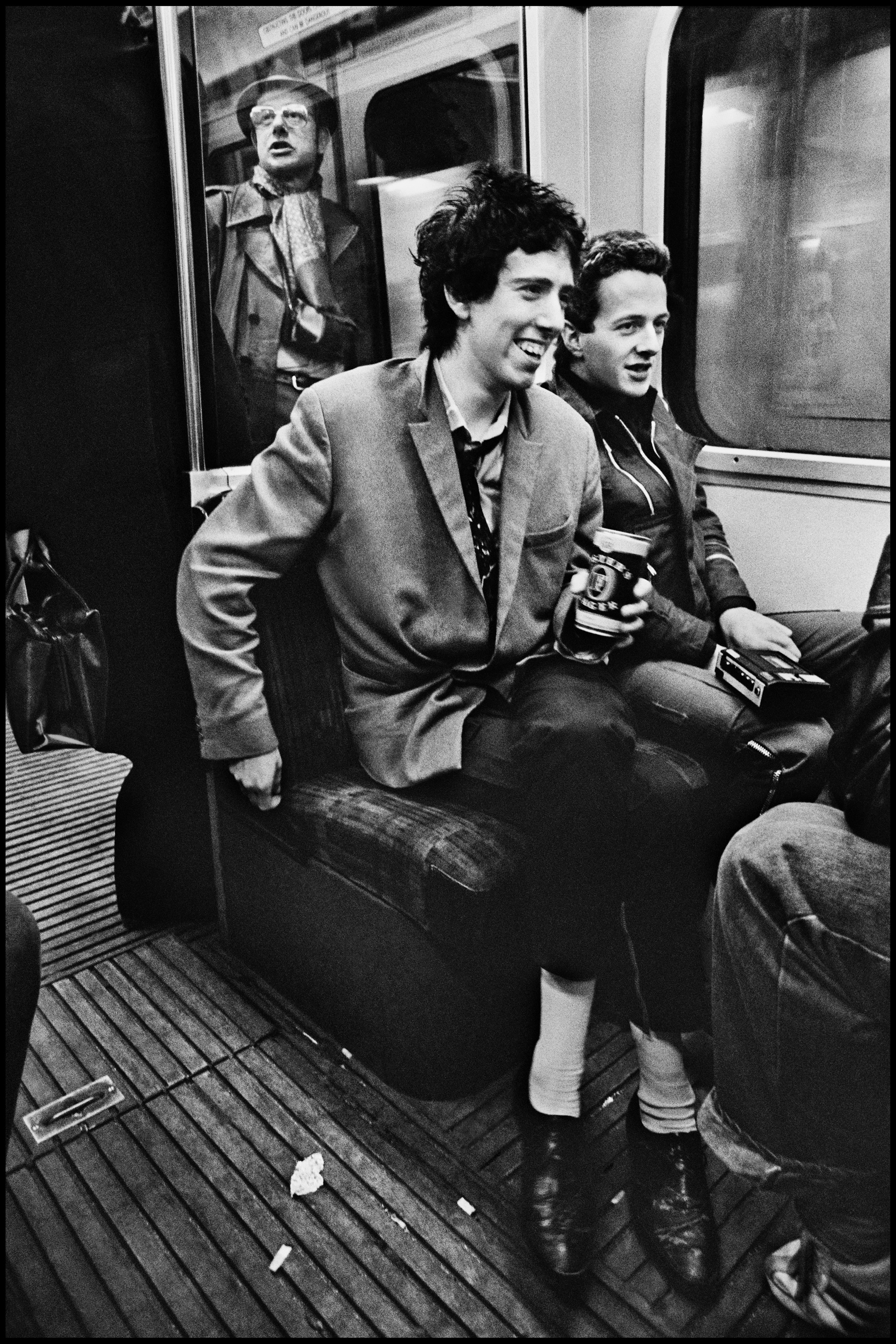 The Clash on the Circle Line 1977 On April 7th 1977 the first Clash LP was released. We put them on the cover of the NME to coincide with this pivotal moment in Rock history. Their manager, Bernie Rhodes, decided that to maintain maximum street credibility the photos and the interview should be done on the Circle Line. Tony Parsons and I were to meet the band at midday on the Baker Street platform. We started the interview but it was incredibly noisy. I took photos but the moving train was not the easiest place to work: the smoking car we were in was filthy and I was also worried about camera shake. In the end we used a close head shot photo for the cover, and this frame was never used. So for more than 35 years it has remained unseen, but I think it stands the test of time quite well. What comes across to me is just how young we all were back then, in 1977.