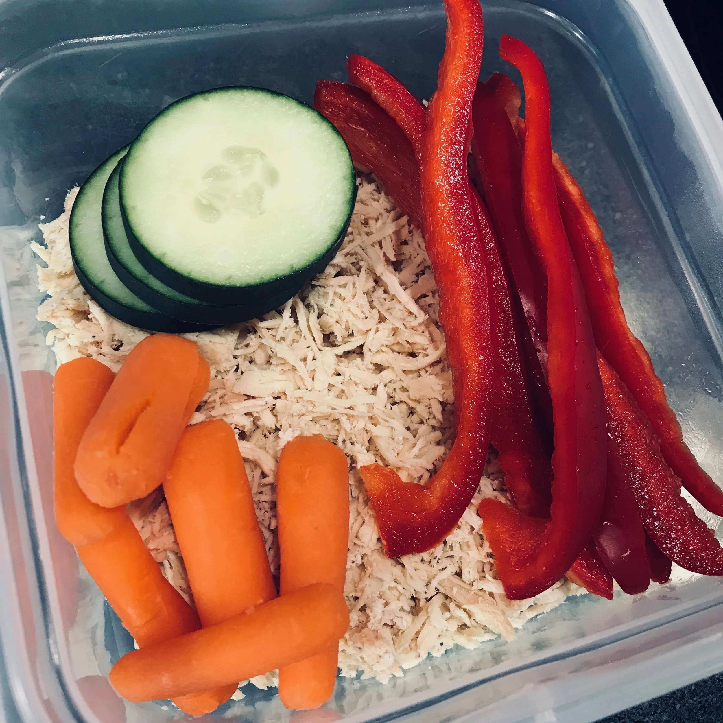 Shredded chicken, carrots, red peppers, cucumbers.