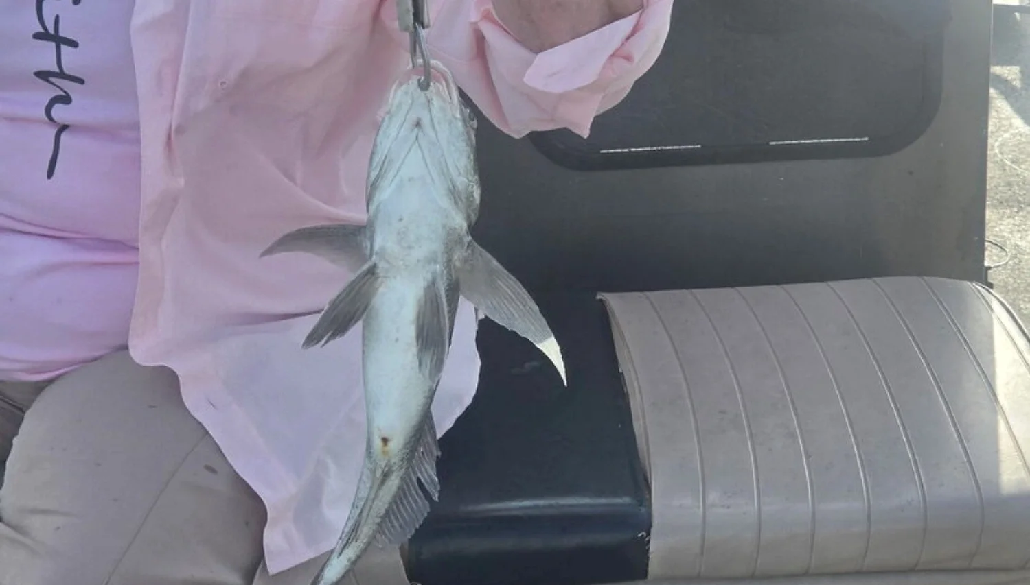 Texas Crew'd guest holding a black drum on a July 1 Rockport half-day trip