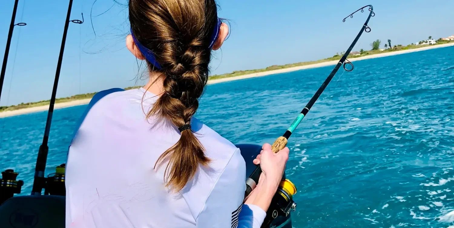 female fishing inshore