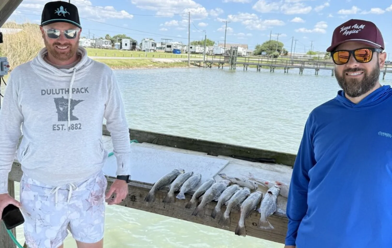 Jay Houser fishing group with a limit of trout after a May 3 2026 Rockport half-day trip with Texas Crew'd