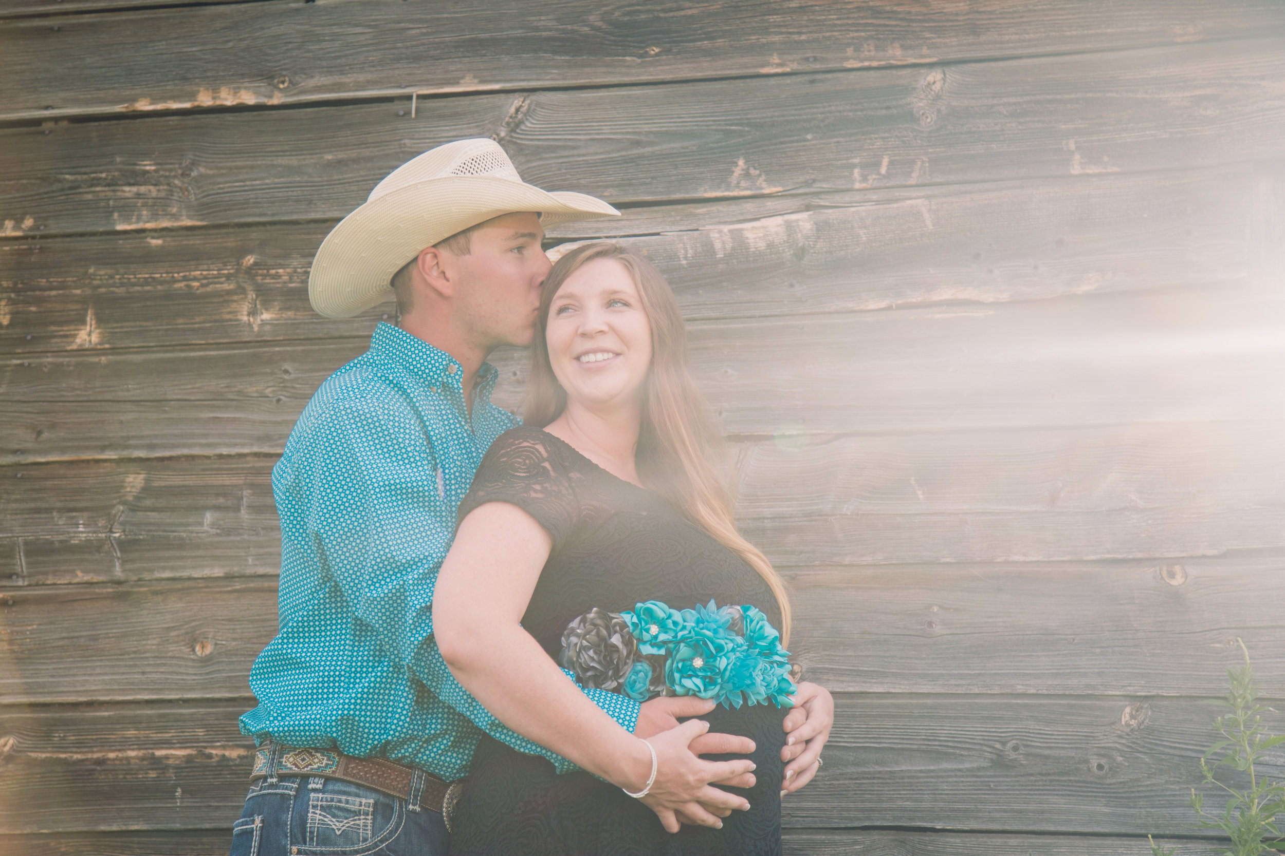 cowboy maternity rustic western barn holding belly