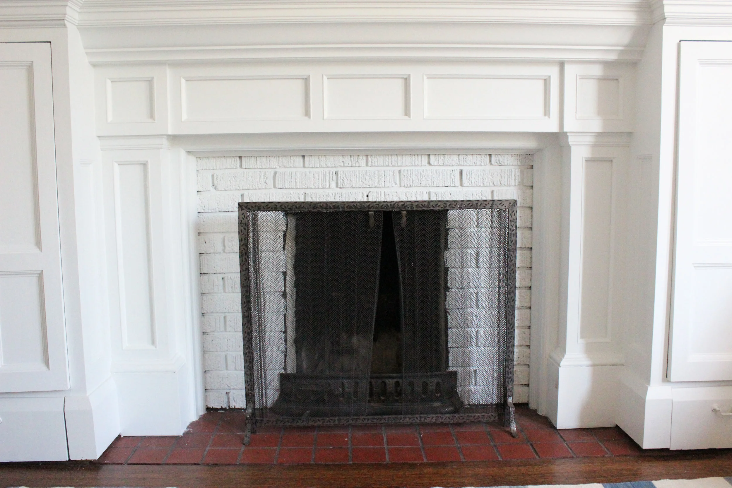 Our healthy brick fireplace post paint, lovely fresh, clean pop! 