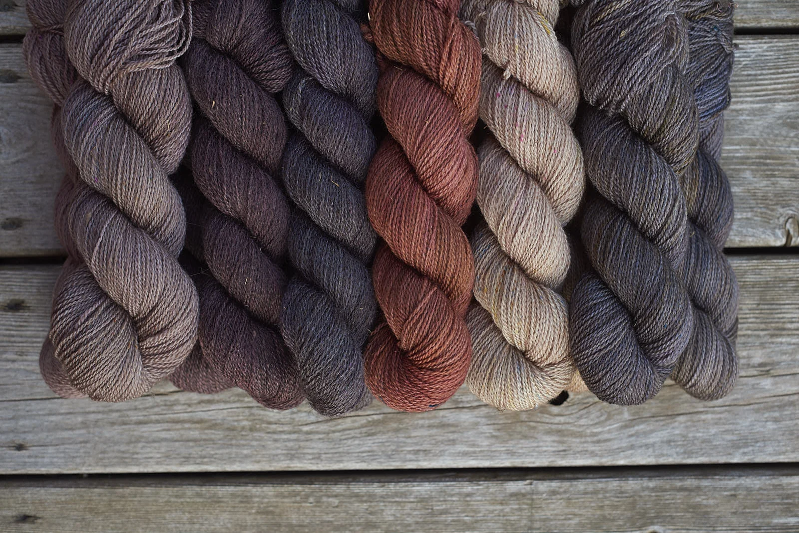 Persephone dyed over white and dark grey natural colours.