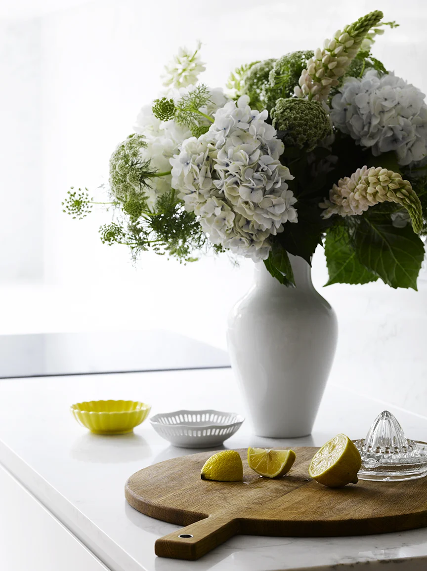 A corner of a fresh white kitchen in Neutral Bay . 