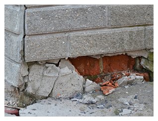 Photograph of a crumbling building foundation as as metaphor to building someone on false assumptions.