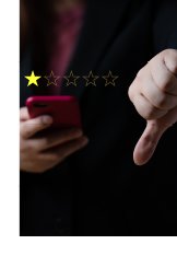 Photograph of person rating something 1 star, and putting thumb down