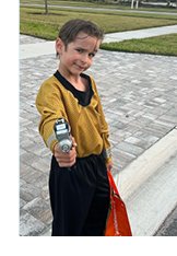 Photograph of young boy dressed as character from Star Trek