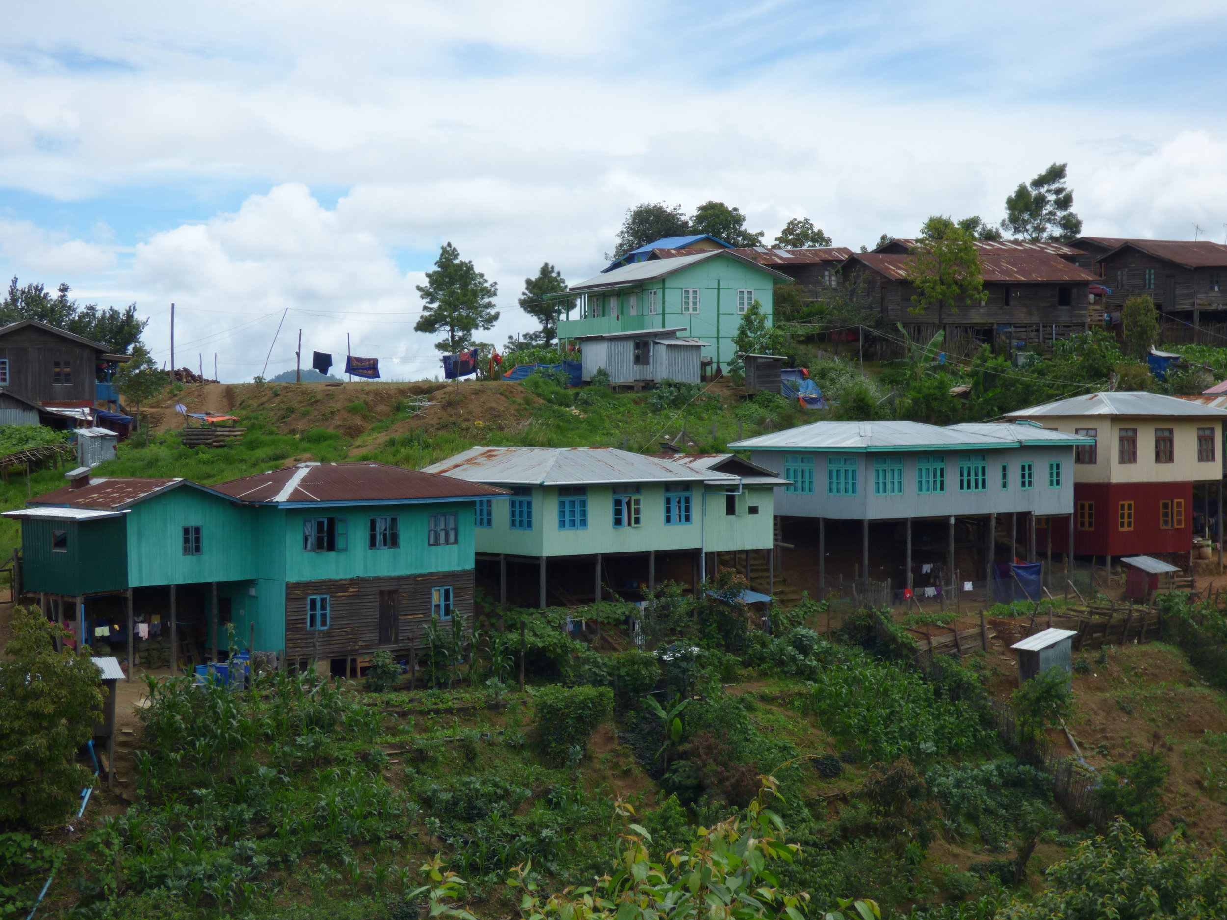 Houses perched in the watershed of the Rung Mountain, which decades ago was heavily forested and protected 