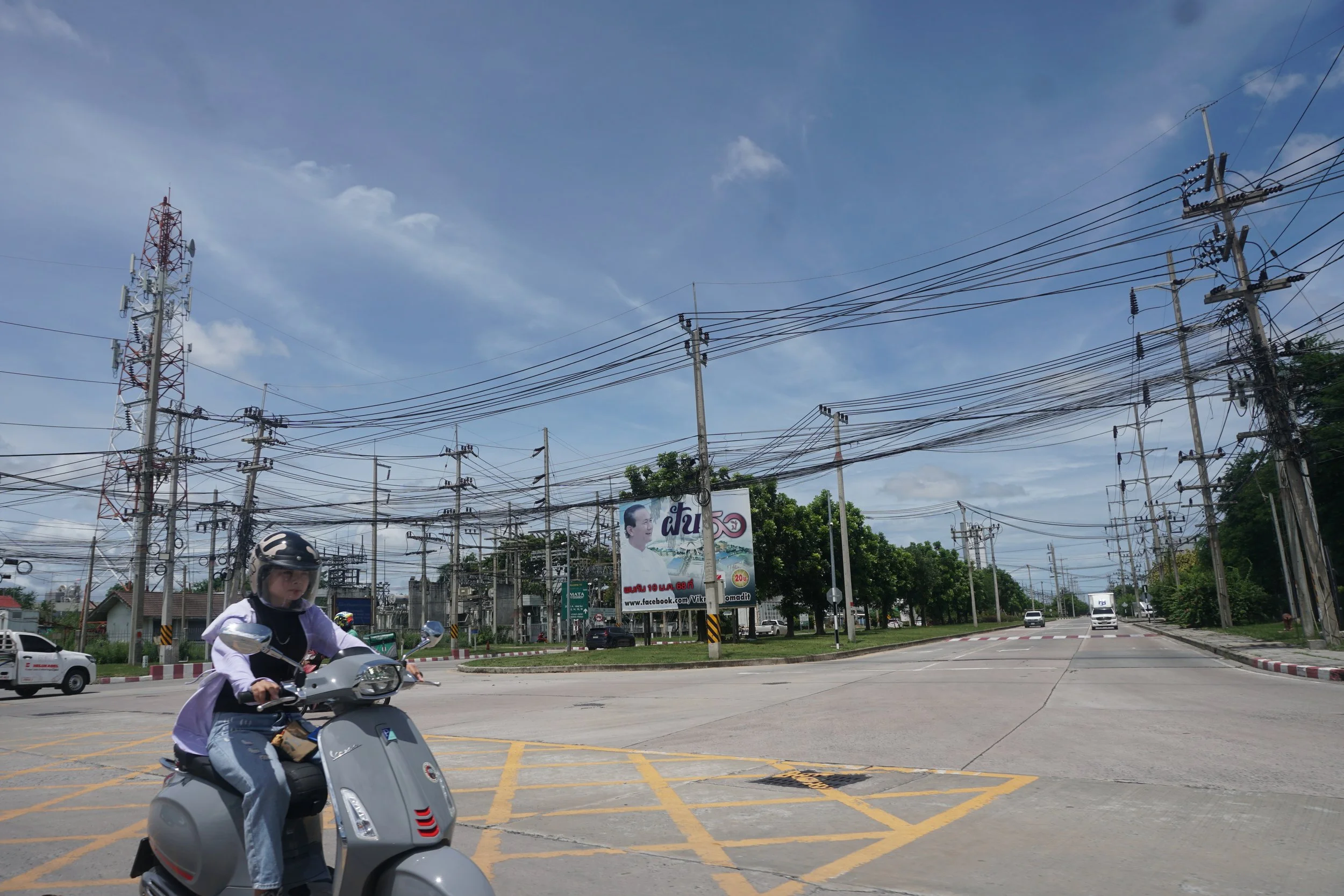  A resident passes by an industrial estate in Rayong Province.&nbsp; Credit: Yuan Ye/ Host: Climate Finance Network Thailand  