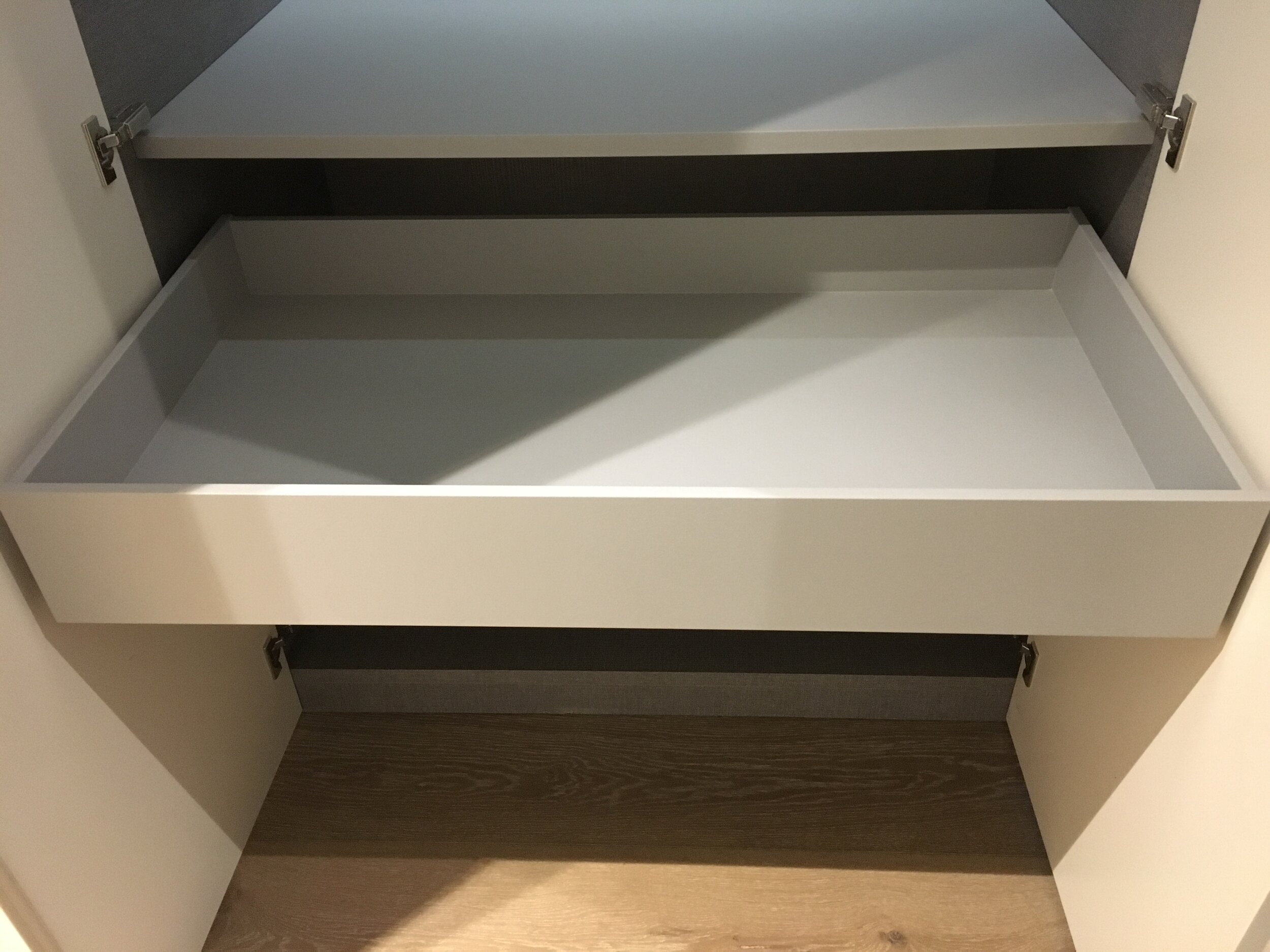 Front-less drawer boxes - for shoe storage.