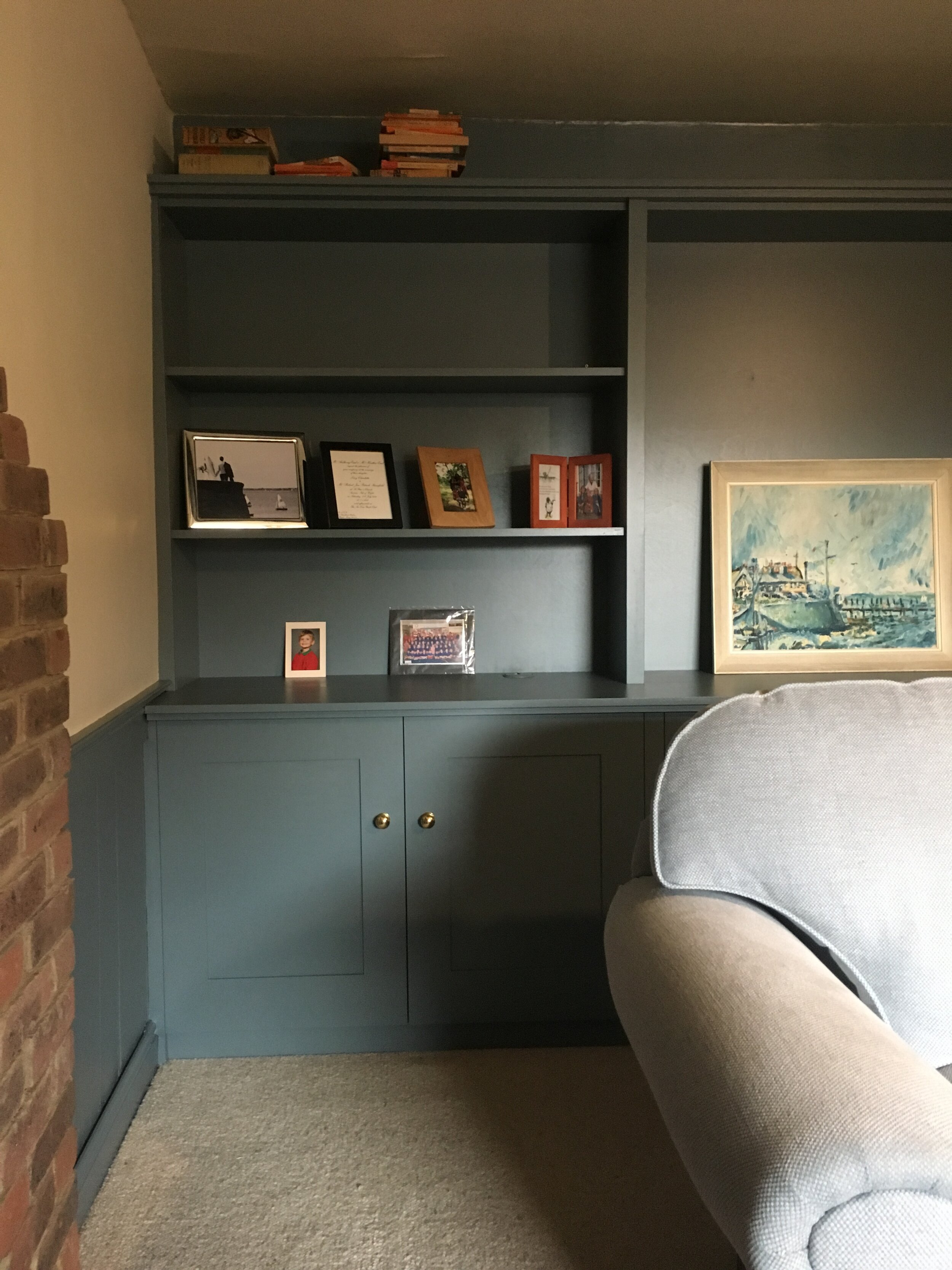 Sitting room bookcases and cupboards.