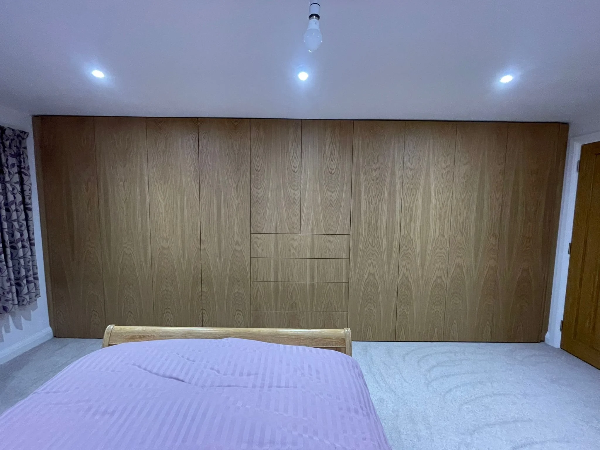 Large oak veneer fitted wardrobes