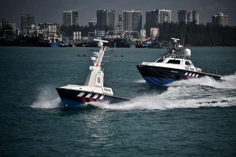  An Unmanned patrol boat leads the way off Singapore 
