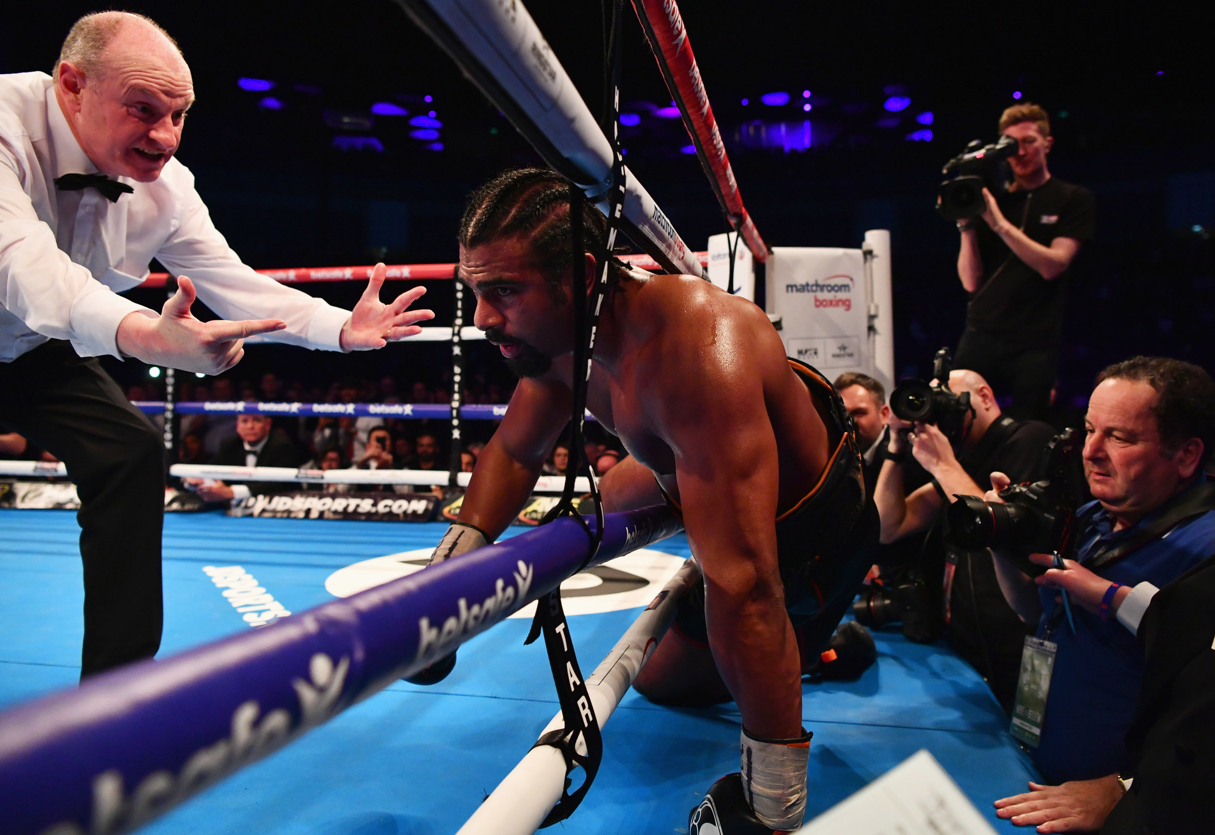  David Haye is knocked through the ropes by Tony Bellew. 