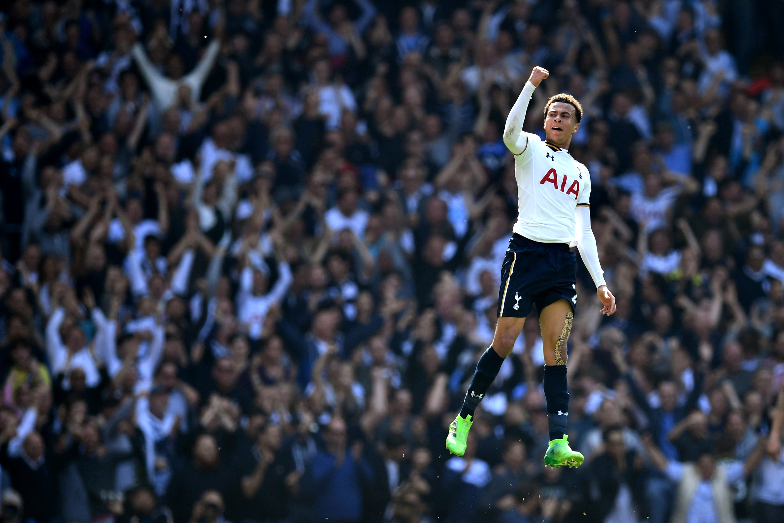  Dele Alli of Spurs leaps to celebrate a goal. 