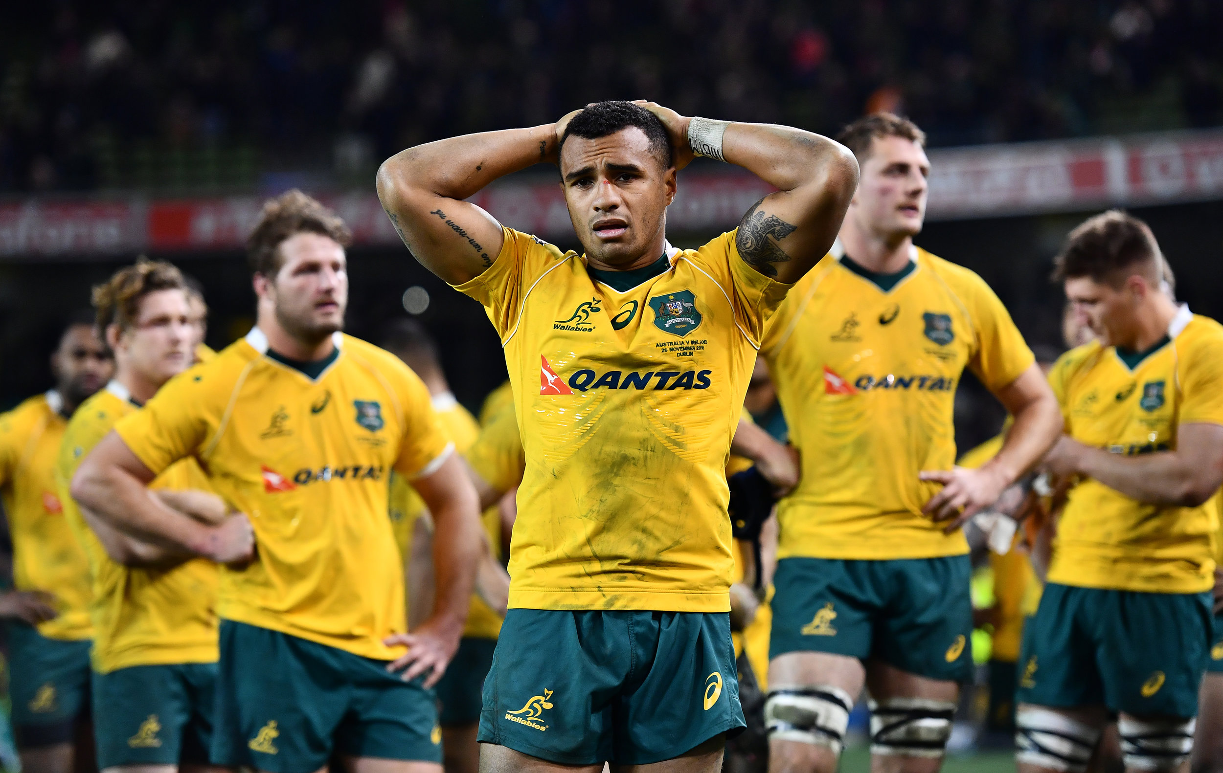  Will Genia and his team mates stand dejected after defeat. 