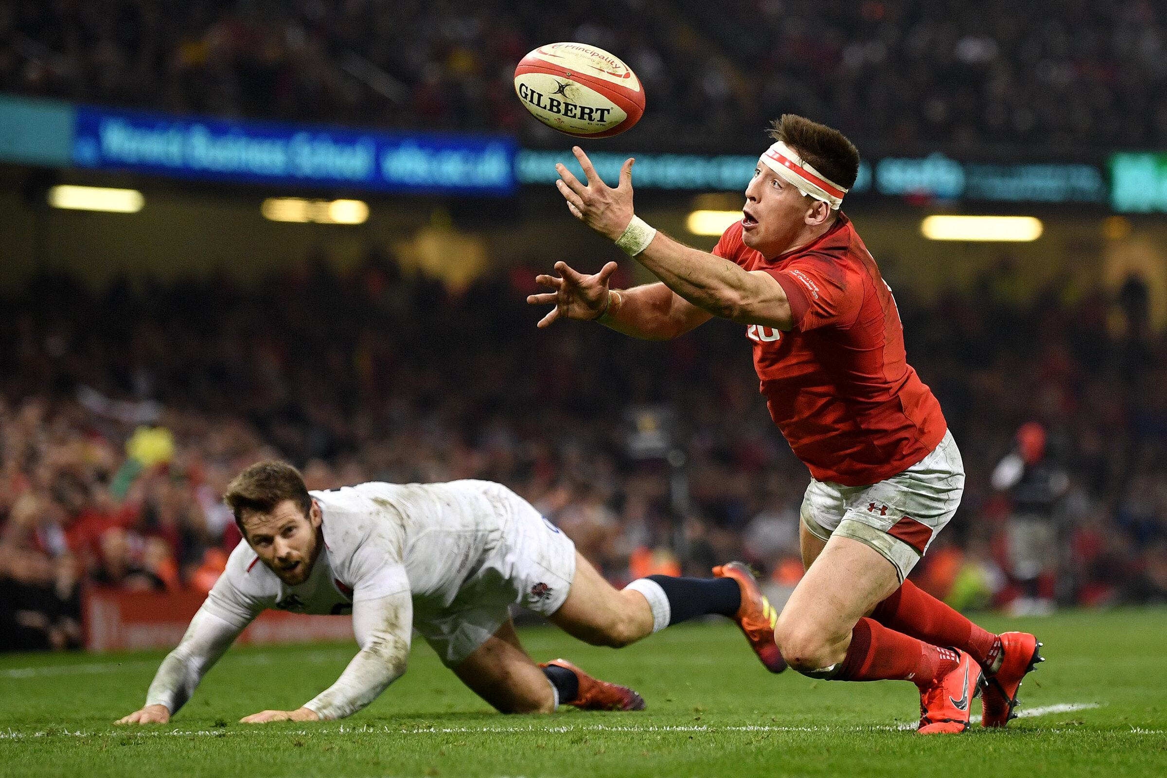  Josh Adams reaches out to gather the ball for a try securing Wales’ Six Nations title. 