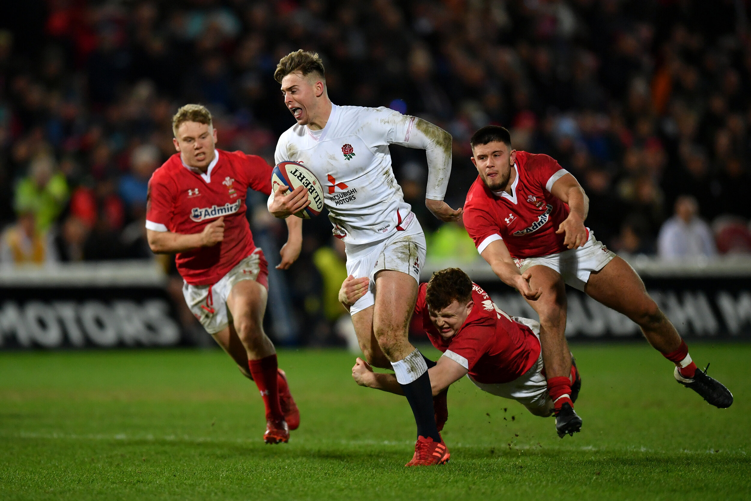  Tom Roebuck bursts through the Welsh defence 