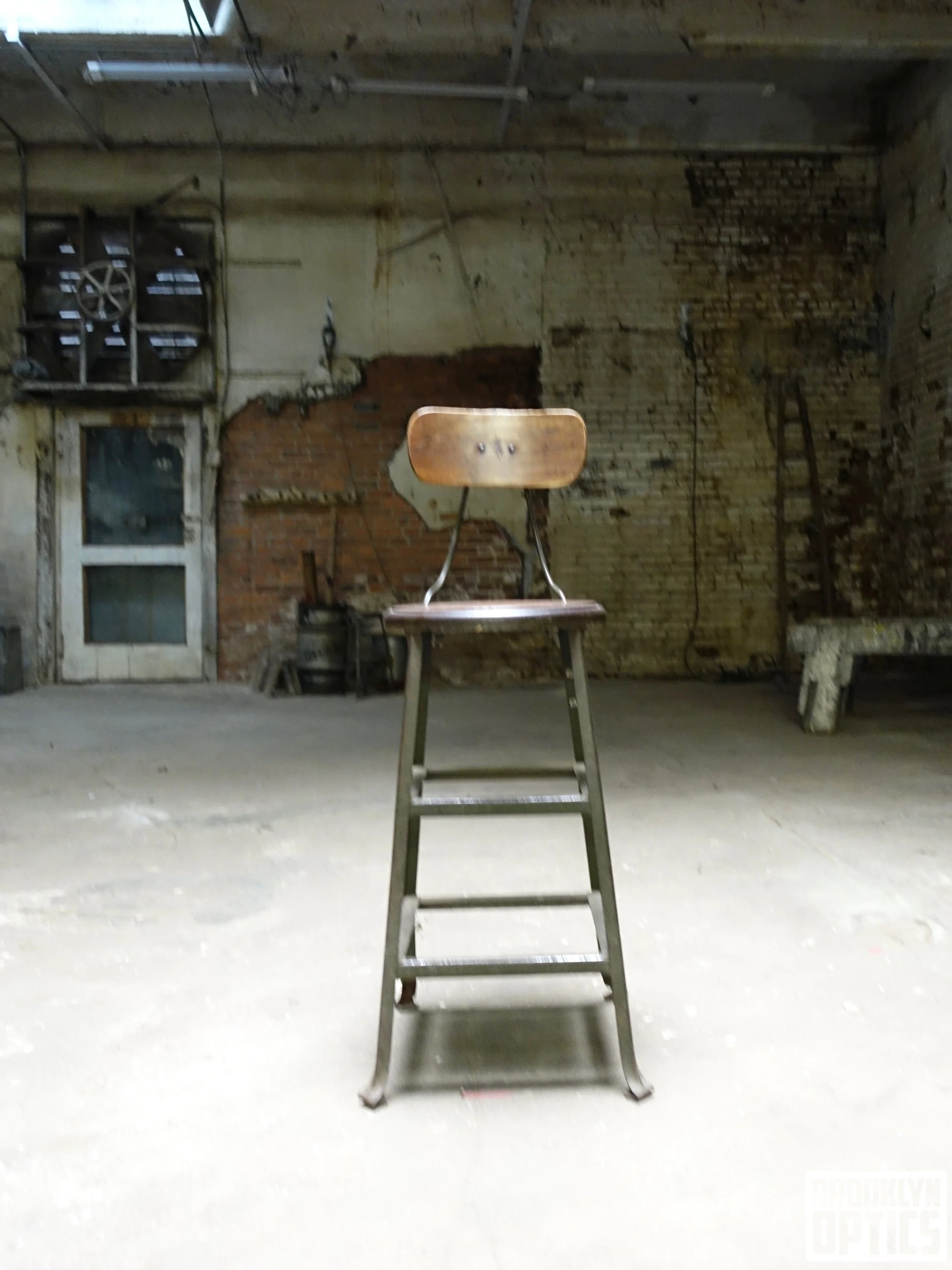 A vintage black Royal typewriter with round keys on a rustic wooden table.
