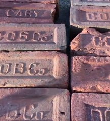 Collecting historic bricks for installation at GlenLily Grounds