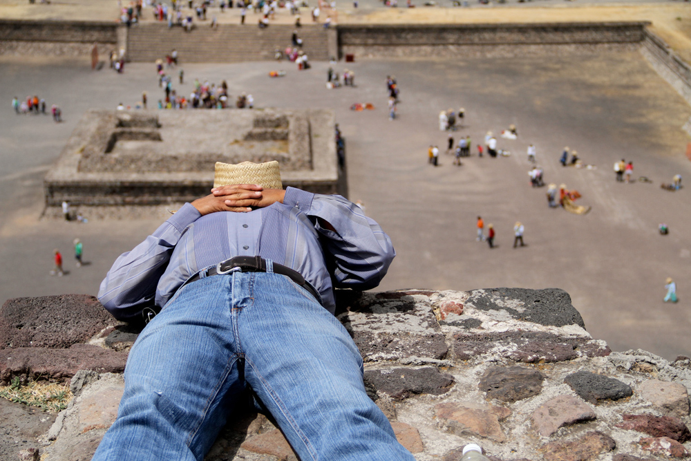  A man takes a break halfway up one of the pyramids at Teotihuacán in March 2014.&nbsp; 
