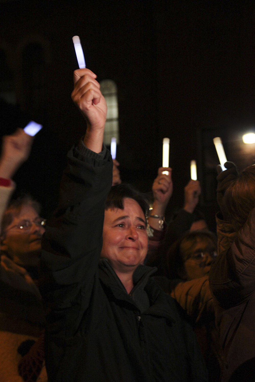  Kelly Griffith raises her glowstick at the candlelight vigil one year after the Jan. 8, 2011 shooting killed six people and injured 13, including then-Rep. Gabrielle Giffords in Tucson, Arizona.&nbsp; 