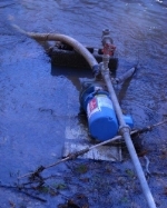 home utilizing water from a creek to stop and get a well drilled for domestic use.jpg