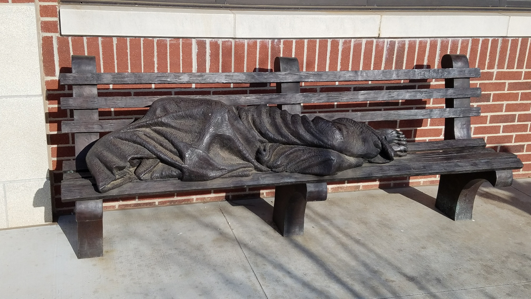  "Homeless Jesus"-by sculptor Timothy Schmalz The pope called. He wants this bench at the Vatican. The article in the comments talks more about this, but they said people stop day and night and sit. They told us that the bench stays clean but the hom