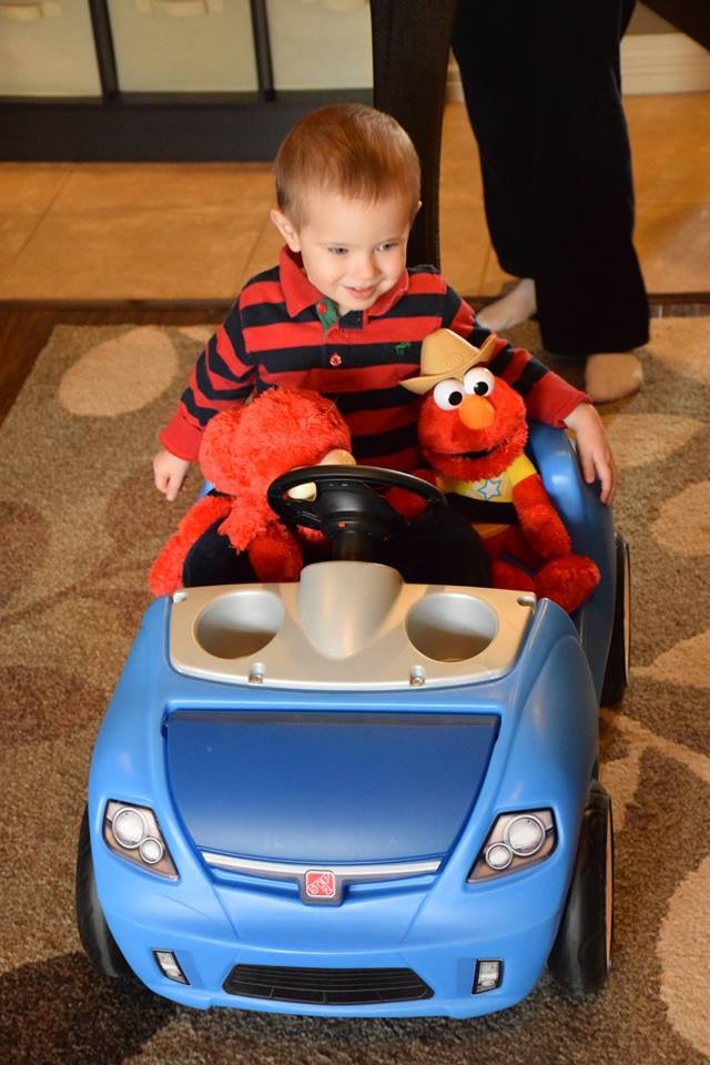So happy to be riding in his own vroom vroom with his friends.