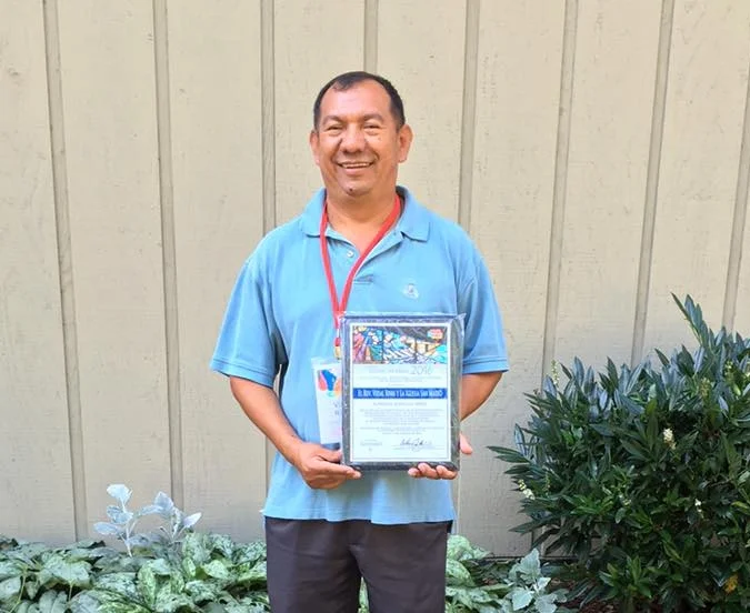 Father Vidal with the Award
