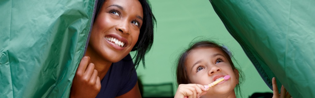young-mother-and-daughter-inside-tent-in-morning-picture-id462613645.jpg