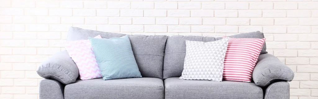 colorful-soft-pillows-on-gray-sofa-picture-id1127523292.jpg