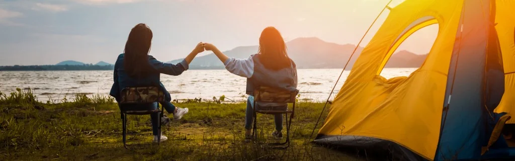 friendship-of-young-women-resting-camp-near-mountain-after-trekking-picture-id1141592623.jpg