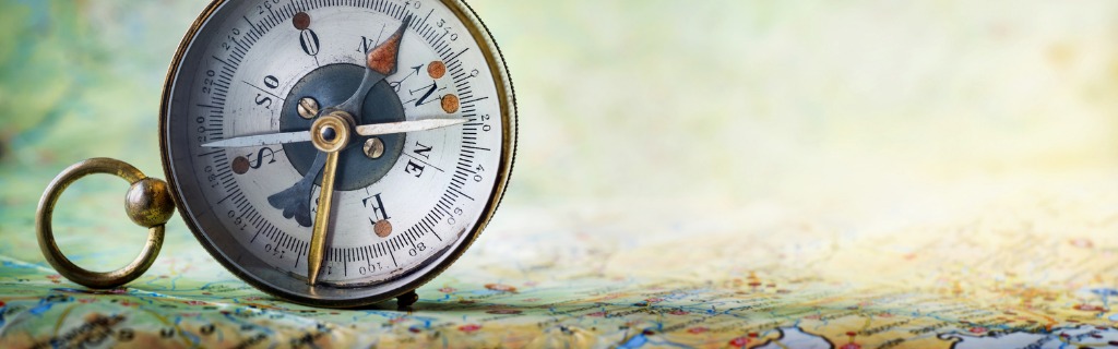magnetic-old-compass-on-world-map-picture-id1012506066.jpg