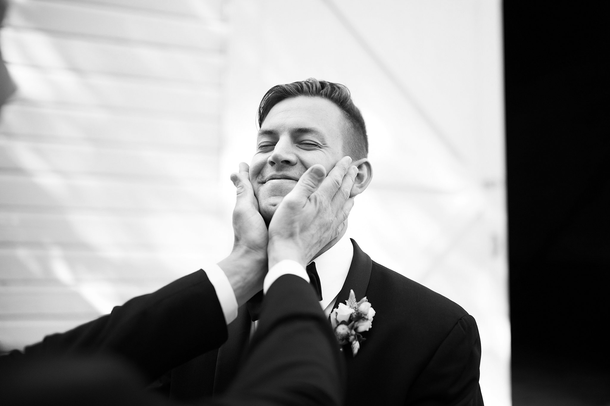  Groom with hands on his face. 