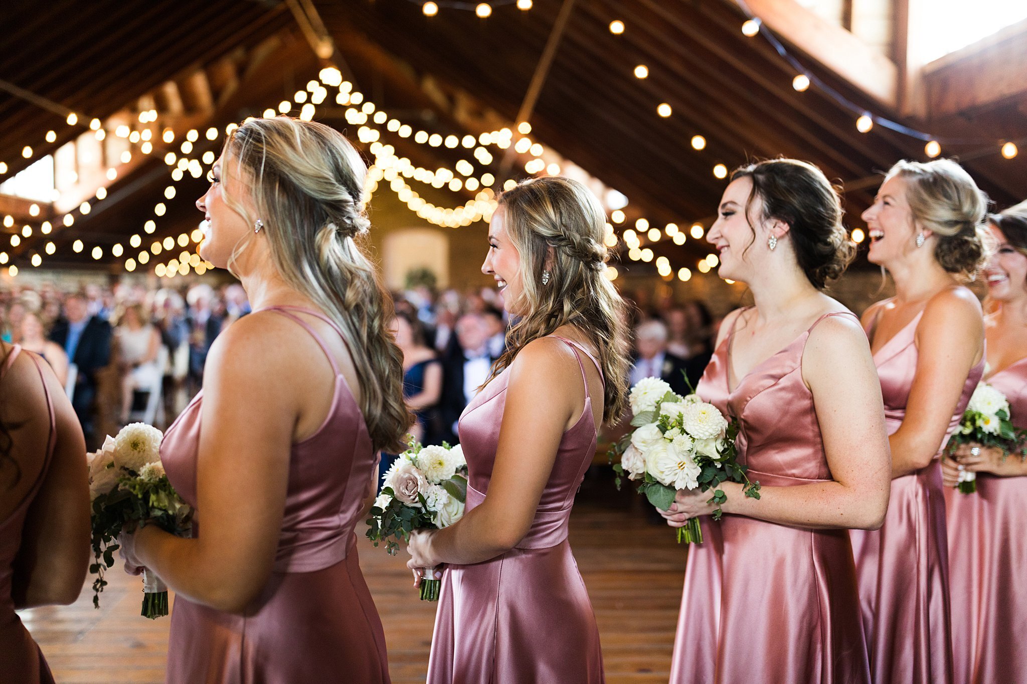  Bridesmaids react to Mayowood Stone Barn wedding ceremony. 