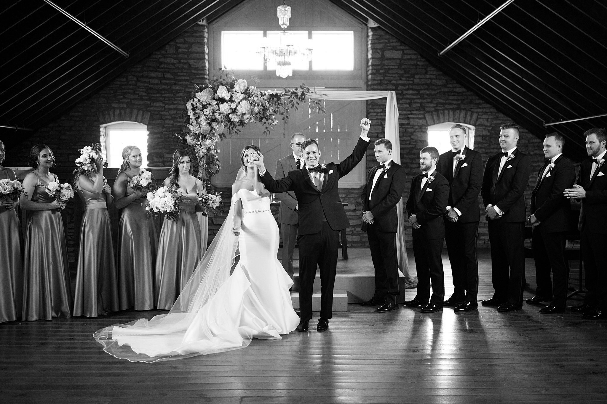  Bride and groom celebrate husband and wife for first time at Mayowood Stone Barn. 