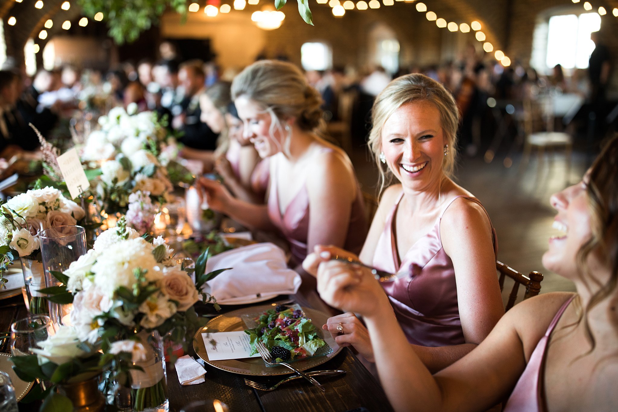  Bridesmaids at head table enjoying a salad during reception. 
