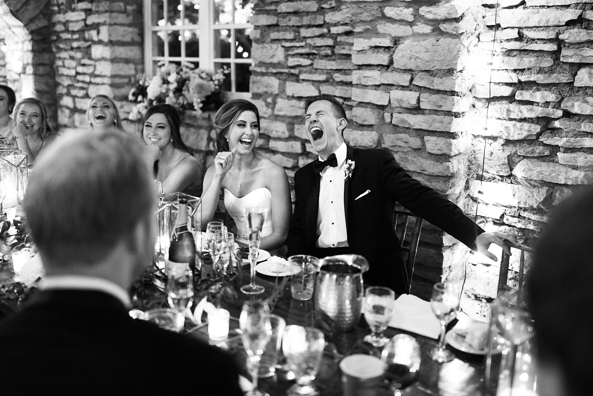  Bride and groom laughing at best man's speech 2 of 3. 