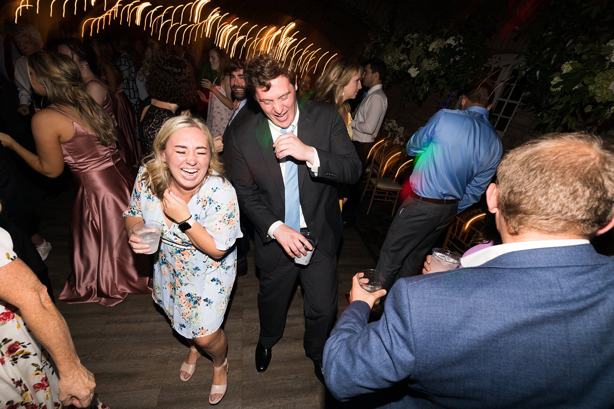  Wedding guests dancing at Mayowood Stone Barn 2 of 11. 